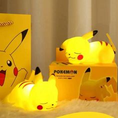 the pokemon pikachu lamp is next to its box