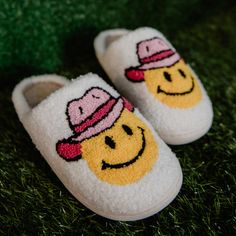 YEEHAW! These cowgirl slippers are the perfect footwear for any cowgirl who wants to feel comfy and stylish at the same time. They have a pink cowgirl happy face on the front. They're made of a soft, fuzzy material with close-toed toes and rubber soles. hand wash warm; hang to dry s/m fits sizes 6-7, m/l fits sizes 8-9, l/xl fits size 10 Cowgirl Slippers, Cowgirl Hats Western, Pink Cowgirl Hat, Preppy Accessories, Hat Western, White Slippers, Preppy Things, Preppy Shoes, Cute Pajama Sets