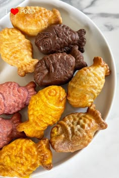 a white plate topped with different types of cookies