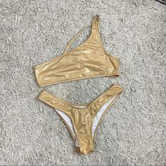 Gorgeous Gold Two Piece Swimsuit. Brand New. One Shoulder Style Top And A Cheeky Style Bottom! Cheeky Swimsuit, Two Piece Swimsuit, Cheeky Bikinis, Womens Swim, Top Styles, One Shoulder, Two Piece, Swimming, Brand New