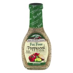 a bottle of salad dressing with apples and peppers