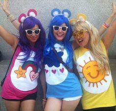 three girls in costumes posing for the camera