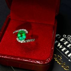 "ENJOY OUR WORRY-FREE SERVICE AND THE DAZZLING, GENUINE JEWELRY WE DESIGN AND HANDCRAFT WITH LOVE❤️ ABOUT THE ITEM: This ring is the perfect combination of elegance, simplicity, and INVESTMENT VALUE! With a CLEAN 1.25 carats, VIVID COLOMBIAN GREEN emerald, and 18 extremely sparkling diamonds. The ring was deliberately designed and handcrafted by our boutique's in-house goldsmiths. You will love this gorgeous piece as much we do. And people will absolute adore it once they see the sparkle and the White Gold Brilliant Cut Emerald Ring For Proposal, Platinum Emerald Ring For Gift, Oval Emerald Ring In Platinum As A Gift, Platinum Oval Emerald Ring As A Gift, Oval Platinum Emerald Ring As A Gift, Emerald Ring With Diamond Cut As A Gift, Gia Certified Pear-shaped Emerald Ring, Brilliant Cushion Cut Emerald Ring As Gift, Gift Emerald Ring With Brilliant Cushion Cut