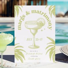 a margarita next to a card that says kiss and matrimony on it with a cocktail in the foreground