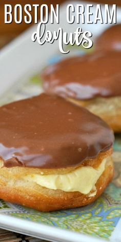 two boston cream donuts on a plate