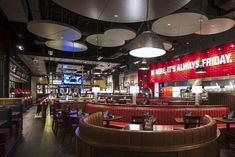 the inside of a restaurant with tables and booths