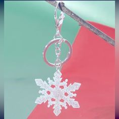 a keychain with a snowflake hanging from it