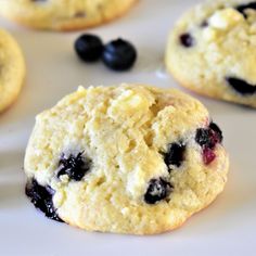 blueberry cookies are arranged on a white plate