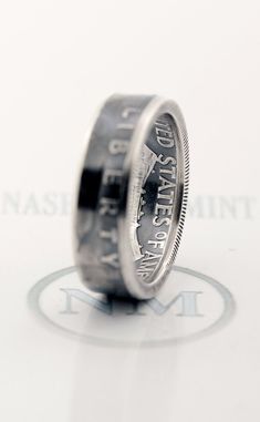 an image of a coin ring that is on top of a white surface with the words, washington d c