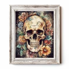 a painting of a skull with flowers on it's head in a white frame