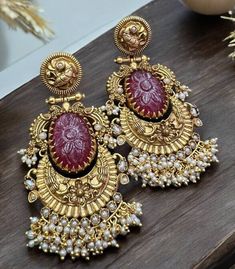 Beauty of Red Kundan Ruby Earrings, adding a touch of vibrant elegance to your ensemble. Discover the exquisite craftsmanship of Amrapali Jewelry and adorn yourself with the regal charm of Polki Earrings. Embrace the timeless allure of Indian Kundan Long Earrings and make a statement with the enchanting designs of Jadau Jewelry. Explore the unique styles of Pakistani Earrings and indulge in the elegance of Amrapali Earrings. *𝐏𝐑𝐎𝐃𝐔𝐂𝐓 𝐃𝐄𝐓𝐀𝐈𝐋* * Material: Brass * Plating: Gold Plated Luxury Diwali Earrings, Pakistani Gold Jewelry, Amrapali Jewellery, Jadau Jewelry, Kundan Chandbali, Pakistani Earrings, Polki Earrings, Chandbali Earrings, Jewelry Antique