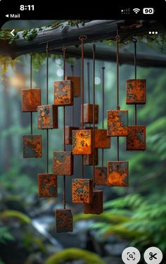 an image of a mobile phone with rusted metal squares hanging from it