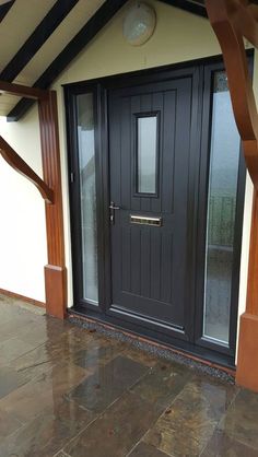 a black front door on a white house