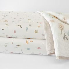 Their favorite animals join them for bedtime with our charming Dakota Baby Bedding. Decorated with detailed animal print and pastel trees, this pure cotton bedding is the softest they'll sleep on. Plus, the crib fitted sheet is woven from pure organic cotton percale and is Oeko-Tex(R) Certified to be safe from over 300 harmful substances for a healthier night's sleep. DETAILS THAT MATTER Quilt Quilt is expertly stitched by hand. Quilt is made of 100% cotton. Percale weave is a tightly woven weav Pottery Barn Dakota Woodland, Montessori Bed Sheets, Nursery Bedding Sets Pottery Barn Kids, Toddler Woodland Bedding, Pottery Barn Nursery Bedding, Nursery Cot Bedding, Woodland Baby Bedding, Woodland Crib Bedding, Woodland Crib