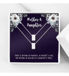 Each necklace comes in a Anavia gift box and can come with a custom gift message card to your recipient. | ● Card comes with a message card. ● Card Design: Purple with flower pattern on the top corner and message on the bottom. ● Card Recipient: "Mother & Daughter" ● Card Message: "There is nothing as powerful as mother's love and nothing as healing as a daughter's smile." ● Includes 2 infinity ring necklaces, one for mother and one for daughter. ● Pendant Available Colors: Silver, Gold, and ros