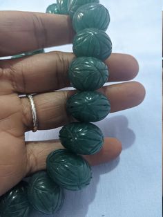 15'' Emerald Beryl AA+ 961 Carat Fine Quality Emerald Pumpkin 18-22mm Beads Gemstone adjustable cord Necklace Stone : emerald beryl Shape :- fancy Pumpkin Necklace - 15 inch 1 line string Size :- 18mm to 22mm Weight :- 961 carat Polish :- Handmade color - green makes a great gift for your loved ones. It is known as the 'love stone' as the message it emits is the strong vibration of unconditional love, joy, warmth and healing. As quartz crystals are profound amplifiers of energy, it may help to k Handmade Adjustable Jade Beads, Jade Beads With Large Beads For Gifts, Large Jade Beads For Jewelry Making, Gift Jade Beads With Large Beads, Adjustable Jade Necklace With Large Beads, Handmade Round Jade Beads, Oval Carved Beads For Gifts, Adjustable Jade Jewelry With Large Beads, Adjustable Carved Round Beads Jewelry