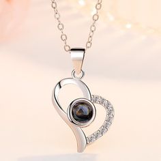 "925 Sterling Silver Crystal Black Zircon Heart Pendant Necklace For Woman, J613 "" Available Size:18 Inch Metal: 925 Sterling Silver Stone: Cubic Zirconia 100 % Lead And Nickel Free 100 % Hypoallergenic Will Not Tarnish Or Fade Perfect For Gift, Holiday, Christmas, Birthday, Vacation, Mother's Day, Valentine's Day, Wedding, Engagement , Bridal, Promise, Anniversary, Party Item Code: N023 Thank You For Shopping With Us!""" Silver Cubic Zirconia Necklace Gift For Mom, Luxury Sterling Silver Heart Charm Necklace, Silver Open Heart Gemstone Necklace, Luxury Silver Heart Necklace With Heart Charm, Silver Heart Necklace With Birthstone - Cubic Zirconia, Black Round Pendant Jewelry For Valentine's Day, Luxury Silver Heart Necklace Gift, Luxury Silver Heart Cut Necklace, Silver Polished Heart Pendant Necklace