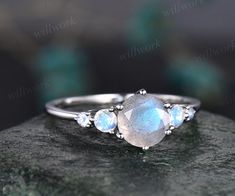 - Metal: Solid gold(10K/14K/18K white/yellow/rose gold),925 sterling silver,platinum available- Main Stone: 7mm round cut natural blue Labradorite- Accent Stone: 3mm and 2mm round moonstones- Can be personalized: Yes Engagement Ring Moonstone, Labradorite Engagement Ring, Dream Proposal, Ring Moonstone, Alexandrite Engagement Ring, Moonstone Stone, Wedding Anniversary Rings, Birthday Ring, Peridot Ring