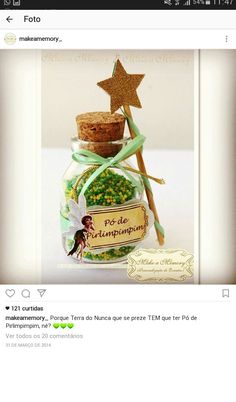 a jar filled with lots of green beans and a star on the top, sitting in front of a white background