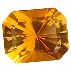 an orange diamond on a white background