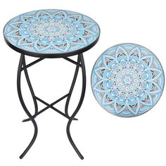 a table with a blue and white design on the top next to a black stand