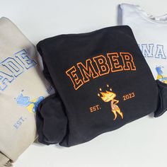 The Disney Elemental Ember and Wade Couple Embroidered Sweatshirt is the perfect gift for couples, with a stylish embroidered design. Stay warm and cozy while showing off your love for this beloved couple. Elemental Ember And Wade, Couple Crewneck, Ember And Wade, Elemental Movie, Couples Sweaters, Disney Hoodies, The Cartoon, Embroidered Sweatshirt, Personalized Embroidered