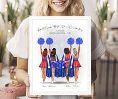 a woman holding up a poster with cheerleaders on it