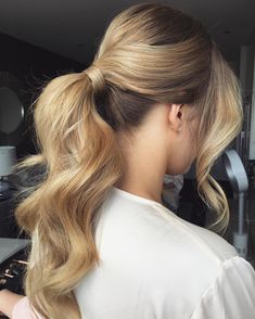 #3: Refined Bridesmaid Hair As a maid of honor, you are technically the bride’s right hand and so, you’re burdened with a whole lot of important tasks you want complete successfully and on time. Besides, you should keep yourself updated on any tiny detail that may appear to make sure the wedding will go off … Bridesmaid Ponytail, Bridesmaid Hair Ponytail, Curly Hair Ponytail, Women Haircuts Long, Wedding Hairstyles Bridesmaid, Curly Ponytail, Bridesmaid Hair Updo