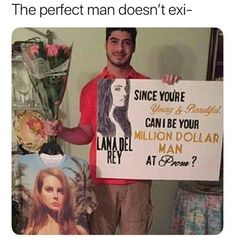 a man holding a sign that says, the perfect man doesn't ex -