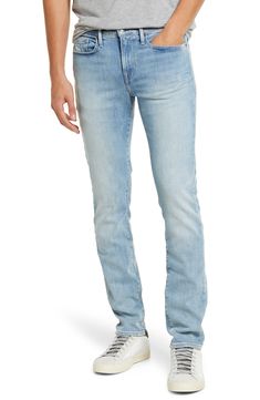 Faded and whiskered stretch denim gives a broken-in finish to casual-cool jeans cut slim through the hips for a modern profile. 32" inseam; 12" leg opening; 9" front rise; 13 1/2" back rise (size 29) Zip fly with button closure Five-pocket style 96% cotton, 3% elasterell-p, 1% elastane. Machine wash, tumble dry Imported Men's Clothing Fitted Denim Blue Jeans With Standard Cut Leg, Fitted Flare Jeans In Faded Rigid Denim, Fitted Flare Jeans With Frayed Hem In Rigid Denim, Fitted Faded Cotton Flare Jeans, Fitted Straight Leg Jeans For Spring, Light Wash Straight Fit Denim Jeans, Fitted Faded Jeans In Rigid Denim, Straight Washed Denim Jeans, Slim Fit Full Length Cotton Jeans