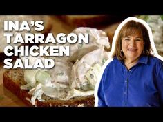 a woman standing in front of a sandwich with chicken salad on it and the caption ina's tarragon chicken salad