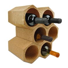 a wine rack made out of cork with two bottles in it