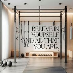 a gym with exercise equipment and an inspirational quote on the wall above it that says, i believe in yourself and all that you are