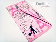 a pink purse with an image of the eiffel tower in paris on it