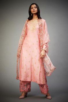 Pink, multi colored kurta with floral embroidery. Comes with embroidered pant and dupatta.
Components:3
Pattern:Embroidered
Type of Work:Chintz
Neckline:Round
Sleeve Type:Full Length 
Fabric:Kurta Shell - Silk Tussar Georgette, Pant - Viscose Satin, Dupatta - Silk Organza, Kurta Lining: 100% Viscose
Color:Pink
Other Details:
Back tassel tie-up
Cutwork hem dupatta
Scalloped hem pant
Weight: 700 gms
Occasion:Wedding - Aza Fashions Bollywood Palazzo Set With Straight Kurta And Floral Embroidery, Bollywood Style Palazzo Set With Floral Embroidery, Diwali Floral Embroidered Straight Kurta Churidar, Spring Sharara With Straight Kurta And Dupatta, Diwali Floral Embroidered Churidar With Straight Kurta, Diwali Floral Embroidery Straight Kurta Churidar, Diwali Floral Embroidery Churidar Straight Kurta, Diwali Floral Embroidery Straight Salwar Kameez, Chanderi Sharara With Floral Embroidery For Eid