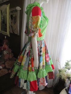 "60s' cutest/colorful all cotton patchwork/cowgirl/square-dance/Bo Ho dress EVERRR!! Dress is a probable handmade for a movie prop from years back in my archive. There is no size tag or label, but made very well. Each patch piece print is stitched, with every color in the Rainbow (floral, checks, etc.), in a very huge gathered from the waist skirt, with a mint gathered layer in the skirt near the bottom, with white zig-zag middle trim. The bodice is mint with double ruffled collar, trimmed with Retro Multicolor Square Neck Dress, Fitted Colorful Patchwork Dresses, Retro Green Patchwork Dresses, Vintage Multicolor Patchwork Dresses, 60s Skirt, Citrus Dressing, Bo Ho, Square Dance, Gathered Dress