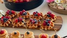 some waffles with berries and blueberries on them