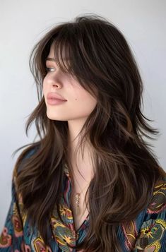 Thinking about updating your long locks? Long layered cuts are a great way to add some oomph to your style without losing length. Whether you're into subtle changes or want a more dramatic look, layers can be excellent for volume, texture, and framing the face. We've rounded up some cool… Harsh Layers Long Hair, Haircut For Long Thick Wavy Hair Ideas, Haircut For Slightly Wavy Hair, Haircut Styles For Women Medium Layers, Haircuts For Long Hair Side Bangs, Choppy Side Bangs With Long Hair, Princess Layers Hair, Long Shag Haircut Unstyled, Haircuts Long Thick Wavy Hair