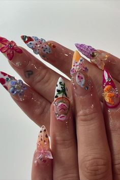 These maximalist nails by @aloez.nailz (IG) feature vibrant, colorful orchids paired with a variety of mix-and-match patterns. The bold and eclectic design creates a dynamic and eye-catching look, perfect for making a statement. Get inspired by 25 gorgeous orchid nails that will make your fingertips blossom! Perfect for adding a feminine and elegant touch to your style, these designs are a must-try this season. Funky Colorful Nails, Nails Maximalist, Eclectic Nails, Colorful Orchids, Maximalist Nails, Lexi Nails, Orchid Nails, The Orchid, Almond Acrylic Nails