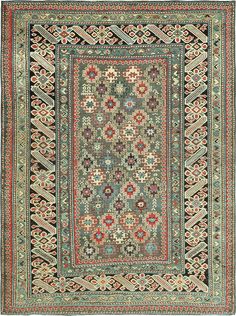 an antique persian rug with many different colors and patterns on it's border,