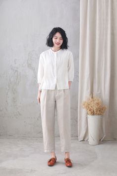 "Soft and comfy women linen blouse for summer, casual style blouse, loose fit size. Details: * linen shirt * rolled collar * 3/4 length sleeves * front button closure * loose and comfortable * causal women style * The model is 170cm (5′7″) tall with a 84cm (33\") bust, 66cm (26\") waist. She is wearing the green dress in size XS. Choose CUSTOM Order if you * Can't find your size in our size Chart * Your Height is not Between 5'1\" - 5\"9\" * Your weight is over 80kg SIZE GUIDE Size vary between White Linen Blouse, Oversized Linen Shirt, Rolled Collar, White Linen Shirt, Wool Coat Women, Wool Clothing, Linen Blouse, Winter Coats Women, Linen Women