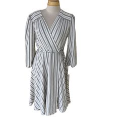 Nwt Calvin Klein White/Grey Striped Faux Wrap Dress Size 4 Crossover Neck, Waist Ties, Elastic At Sleeve Ends & Zip Back Pet Friendly, Smoke Free Home Questions? Leave A Comment Below! Gray A-line Mini Dress For Spring, Gray V-neck Mini Dress For Spring, Gray Spring Daywear Dresses, Calvin Klein Casual Fall Dresses, Spring Gray Knee-length Mini Dress, Gray Knee-length Mini Dress For Spring, Casual Long Sleeve Dresses By Calvin Klein, Casual Long Sleeve Calvin Klein Dress, Gray Dresses For Spring Day Out