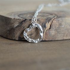 A simple and minimalistic sterling silver hammered heart pendant floating on a dainty sterling silver chain. Beautiful on its own or layered with other necklaces. The hammered, open-heart pendant measures 14mm x 14mm. Please feel free to contact me if you have any questions. ---------------- Shop other hearts jewelry here: https://etsy.me/33l4IjY ---------------- 🎁 PACKAGING AND GIFT NOTES🎁 PACKAGING: All Neos jewelry comes nicely wrapped in a jewelry box. Included in the box: - an anti-tarnis Sterling Silver Hammered Necklaces For Anniversary, Hammered Sterling Silver Necklaces For Anniversary, Sterling Silver Hammered Necklace For Anniversary, Anniversary Sterling Silver Hammered Necklace, Sterling Silver Heart Necklace With Delicate Chain For Anniversary, Hammered Silver Heart Jewelry, Heart-shaped Hammered Sterling Silver Jewelry, 25 Wedding Anniversary, 25 Wedding Anniversary Gifts