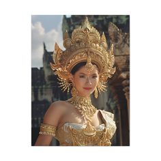 a woman dressed in an elaborate golden outfit and headpiece with gold jewelry on her neck