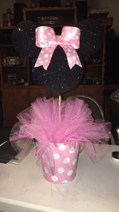 minnie mouse centerpiece with pink tutule and polka dot bow on it's head