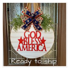 a patriotic door hanger with the words god bless america on it and an american flag bow