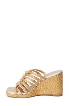 Braided raffia straps weave into one another on this stunning wedge sandal that'll have you ready to hit the cabana in style. 3 3/4" heel; 3/4" platform Textile upper/synthetic lining and sole Imported Vacation Stacked Wedge Heels, Elegant Heels For Beach Season Vacation, Elegant Heels For Beach Vacation, Elegant Wedge Heel Sandals For Beach, Straw Wedge Heel Sandals For Beach Season, Straw Wedge Sandals For Beach Season, Straw Wedge Sandals For Vacation, Elegant Open Toe Wedge Sandals For Beach Season, Chic Beach Wedge Sandals With Stacked Heel