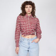 Vintage 70s western pearl snap shirt in a unique red, green, and white plaid, with lines of embroidered thread that give it texture. Measurements and Condition: Fits like: Women's medium (has a slightly petite fit) Fabric: Feels like cotton/poly Brand: Rockmount Ranch Wear, made in USA Condition: Excellent Length: 25" in front, 26" in back Chest: 39" Waist: 36" Shoulders (seam to seam): 14" Sleeve: 24" Shown on a 5'8" model with measurements of 34"-26"-37", usually wears a size small. See our FA Plaid Shirt For Rodeo In Fall, Casual Plaid Tops For Rodeo, Vintage Collared Tops For Rodeo, Retro Collared Tops For Rodeo, Fitted Plaid Western Tops, Fitted Western Plaid Tops, Vintage Long Sleeve Top For Rodeo, Vintage Shirt For Rodeo In Fall, Vintage Red Tops For Rodeo