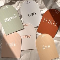 five different colored tags with the words three, two, and one