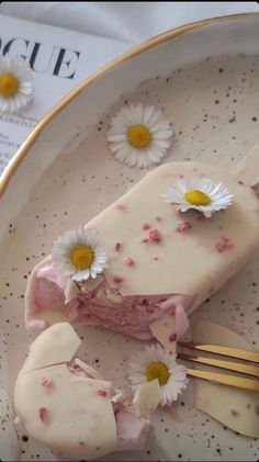 a white plate topped with food and flowers